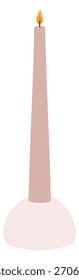 A candle is lit and is tall