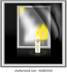 candle at a mirror on a black background