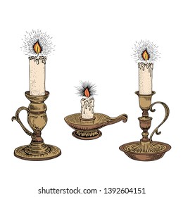 Candle sketch set. Hand drawn vector illustration of a burning candle with rays of light in vintage style