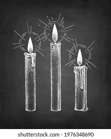 Candles burning. Chalk sketch on blackboard background. Hand drawn vector illustration. Retro style.