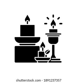 Candles and candle holders black glyph icon. Soft and cozy style. Lanterns, sconces, candlesticks. House decor and interior design. Silhouette symbol on white space. Vector isolated illustration