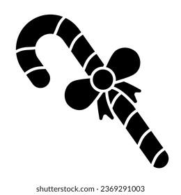 Candy with bow solid icon. Christmas striped cane stick glyph style pictogram on white background. Christmas spiral caramel for mobile concept and web design. Vector graphics