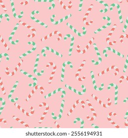 Candy cane. Chaotically scattered sweets. Endless vector pattern. Continuous Christmas ornament of striped red and green lollipops. Isolated pink background. Flat style. Idea for web design.