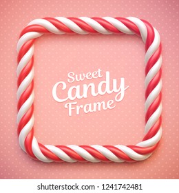 Candy cane frame on polka dot background. Swirl hard candy square border with copy space.