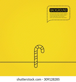 Candy cane icon. Sugar lollipop sign. Sweet lolly pop symbol. Speech bubble of dotted line. Orange background. Vector