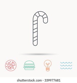 Candy cane icon. Sugar lollipop sign. Sweet lolly pop symbol. Global connect network, ocean wave and burger icons. Lightbulb lamp symbol.