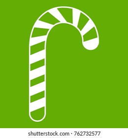 Candy cane icon white isolated on green background. Vector illustration