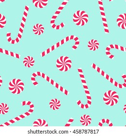 Candy cane and lollipop seamless christmas pattern on mint green background. Happy New Year and Merry Xmas background. Vector winter holidays print for textile, wallpaper, fabric, wallpaper.