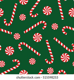 Candy cane and lollipop seamless christmas pattern on green background. Happy New Year and Merry Xmas background. Vector winter holidays print for textile, wallpaper, fabric, wallpaper.