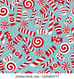 Candy cane pattern. Many types christmas treats on blue background. Traditional red and white xmas ans new year lollypop. Striped candies on snow backdrop. Tasty,  hand drawn delicious holiday print.
