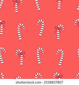 Candy cane with red bow seamless pattern. Christmas sweets backdrop. Festive ornament with candies on red background.  