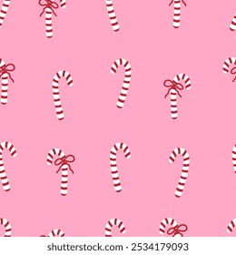 Candy cane with red bow seamless pattern. Christmas sweets backdrop. Festive ornament with candies on pink background.  