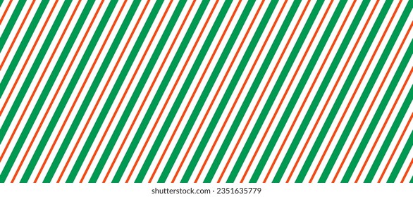 Candy cane seamless pattern. Green and red diagonal stripes background. Christmas repeating decoration texture. Winter holiday line backdrop. Xmas peppermint package wrapping print. Vector wallpaper