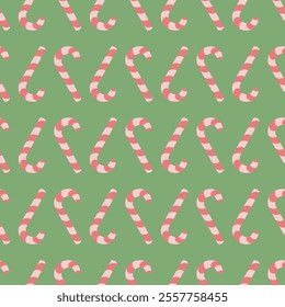 Candy cane. Upside down sweets. Repeating vector pattern. Seamless Christmas ornament of striped red and pink lollipops. Isolated green background. Flat style. Idea for web design.