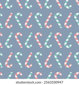 Candy cane. Upside down sweets. Seamless vector pattern. Endless Christmas ornament of striped red and green lollipops. Isolated blue background. Flat style. Idea for web design.