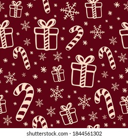 Candy canes, gifts and snowflakes seamless pattern. Christmas doodle style drawings. Several objects related to the winter season and Holiday spirit. Vectorial illustrations on a dark red background.