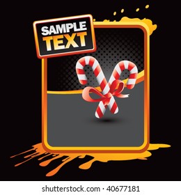 candy canes on orange splattered banner