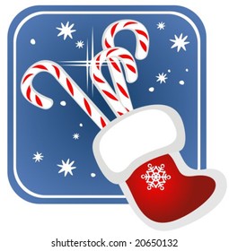 Candy canes and red Christmas stocking on a blue background.