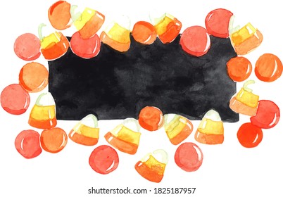 Candy corn and chocolate tablet frame with blackboard copy space for decoration on Halloween festival.