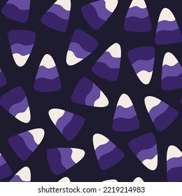 Candy corn seamless pattern, flat vector illustration on dark background. Halloween candy wallpaper. Purple candy corn. Delicious dessert and sweets for kids.