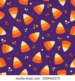 Candy corn seamless pattern isolated on purple backgound. Good for wrapping paper, textile print, label, and other decoartion for Halloween.