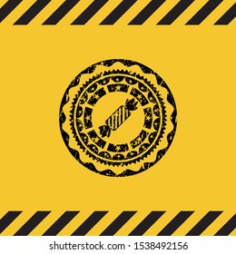 candy icon grunge black emblem with yellow background, warning sign. Vector Illustration. Detailed.