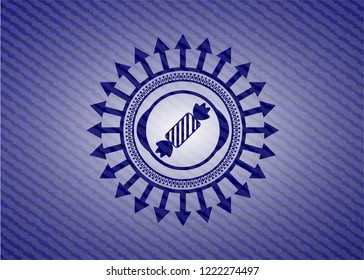 candy icon inside badge with denim background