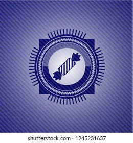 candy icon inside badge with denim texture