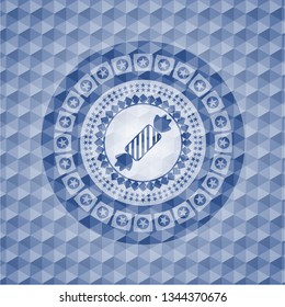 candy icon inside blue emblem with geometric background.