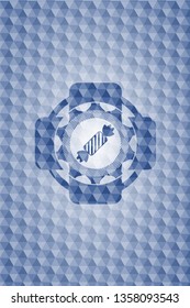 candy icon inside blue emblem with geometric background.