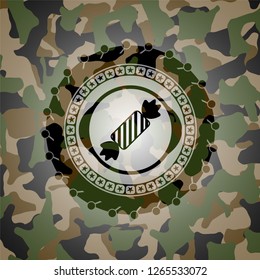 candy icon inside camouflage emblem