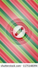 candy icon inside christmas badge.