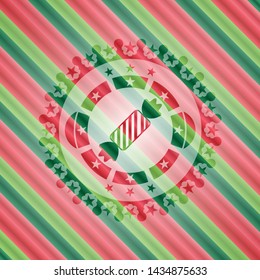 candy icon inside christmas badge background.