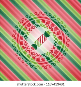 candy icon inside christmas colors badge.