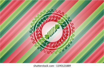 candy icon inside christmas colors style emblem.