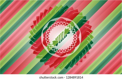 candy icon inside christmas colors emblem.