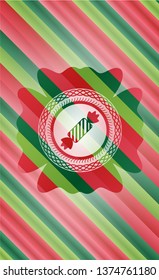 candy icon inside christmas colors style emblem.