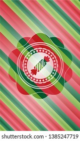 candy icon inside christmas style badge..