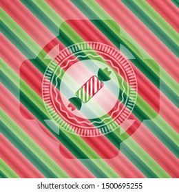 candy icon inside christmas style emblem.