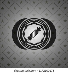 candy icon inside dark emblem. Retro