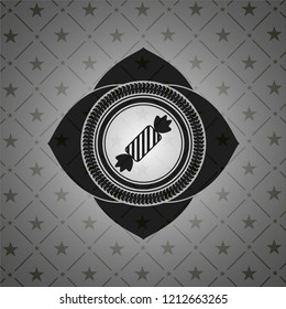 candy icon inside dark emblem. Retro