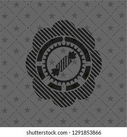 candy icon inside dark emblem