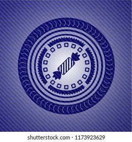 candy icon inside denim background