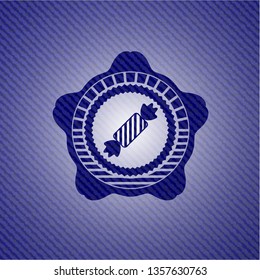 candy icon inside denim background