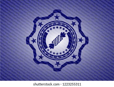 candy icon inside emblem with denim texture