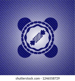 candy icon inside emblem with denim texture