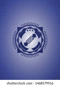 candy icon inside emblem with denim high quality background