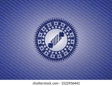 candy icon inside emblem with jean texture