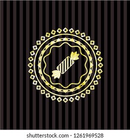 candy icon inside gold emblem or badge