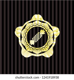 candy icon inside gold shiny emblem